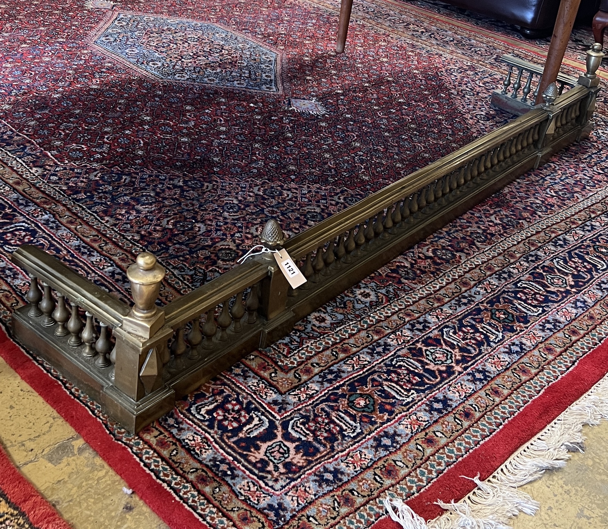 A large late Victorian cast brass fender, width 183cm, depth 32cm, height 30cm